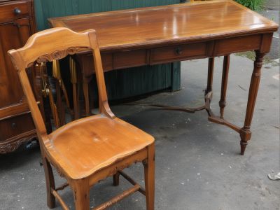 Vintage antique wooden furniture pieces including chairs and tables requiring professional restoration